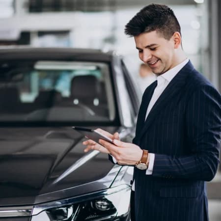 A mechanic inspecting a car