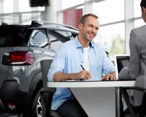 A happy customer receiving keys